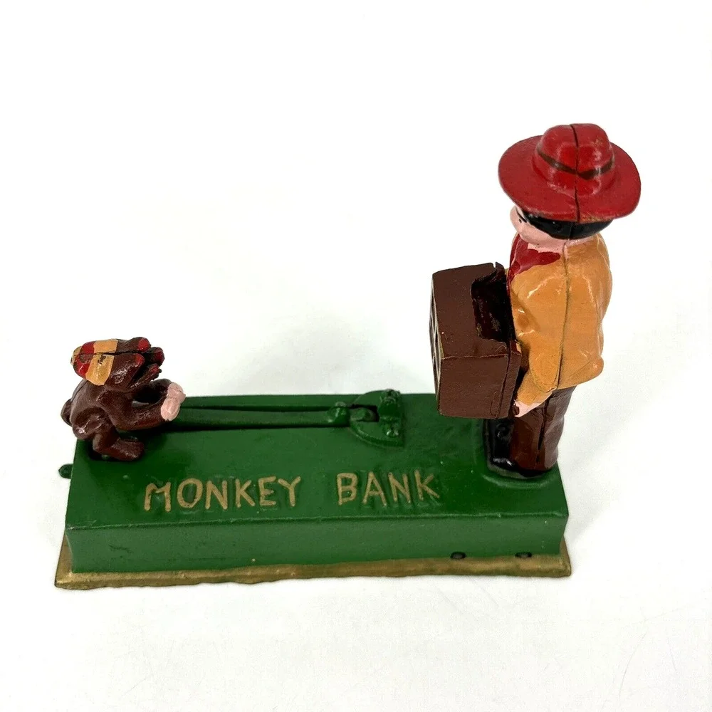 ORGAN GRINDER MONKEY BANK Cast Iron Works Great‎